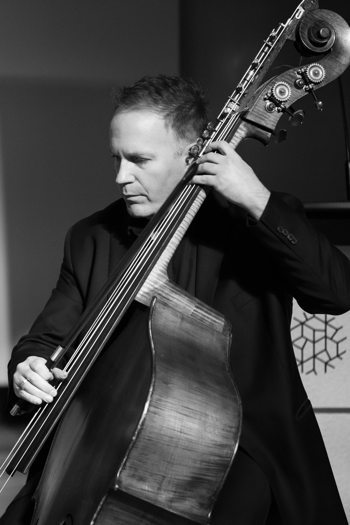 Close portrait of Rob Hutchinson with the double bass
