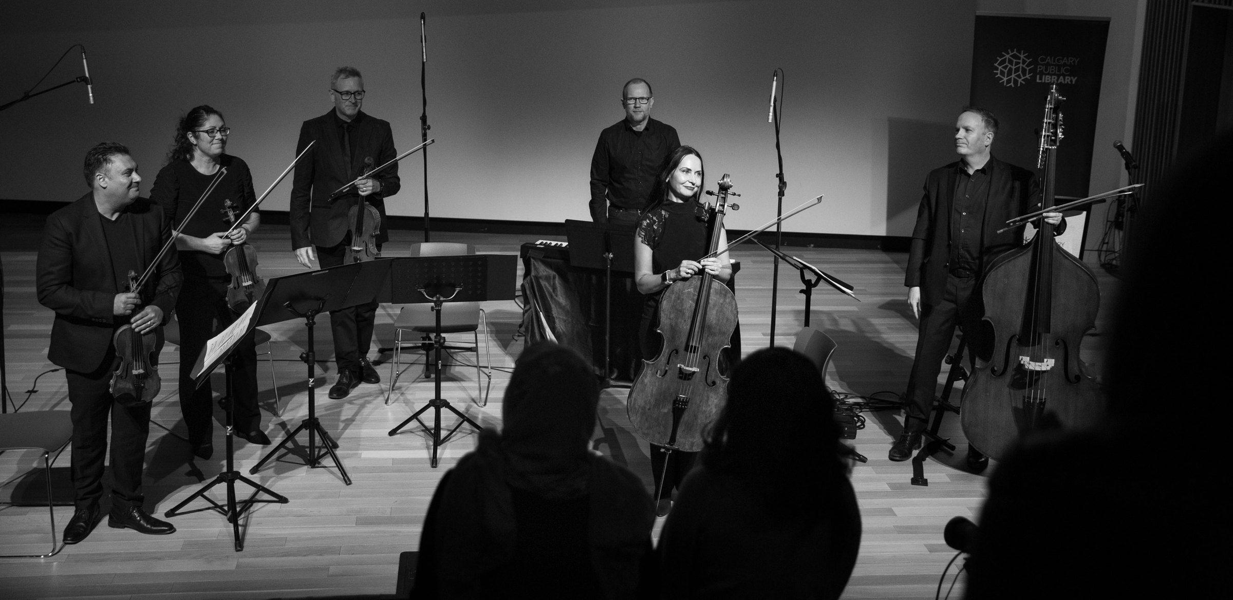 Rob Hutchinson with a string quartet and pianist after a concert